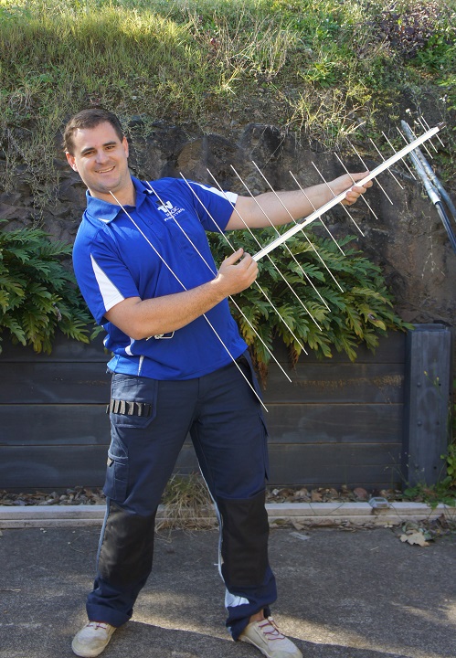 Technician holding out an aerial 