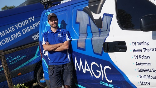 Technician - Alex, next to his TV Magic van.