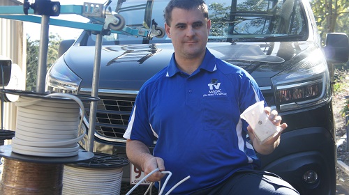 Technician holding a TV point