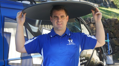 Technician with a satellite dish on his head