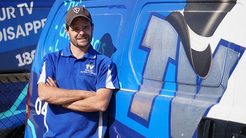 Technician - Alex, next to his van