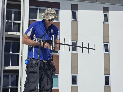 Technician installing a new antenna in Point Grey