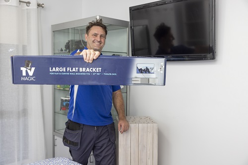 Technician, holding a TV Magic wall bracket