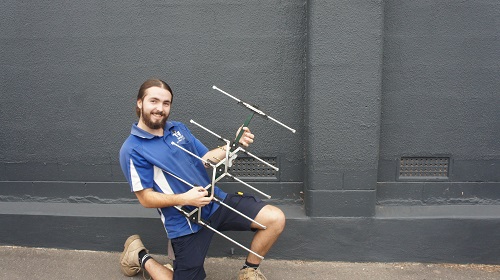 Technician holding an antenna
