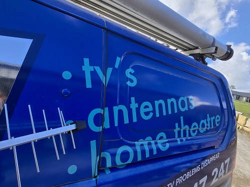 Close up of TV Magic van with antenna on side