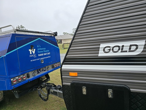TV Magic vehicle in front of a caravan