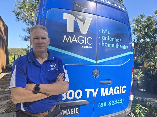 Technician - Robert, standing at the rear of his van.