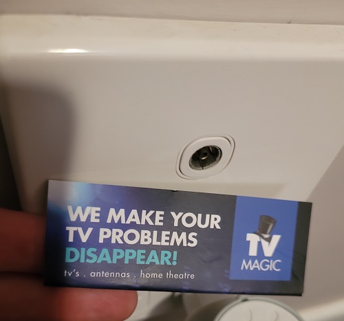 close up of a TV point, with TV Magic biz card in front of it