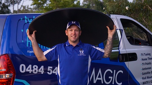 Technician - Matt, holding a satellite dish over his head