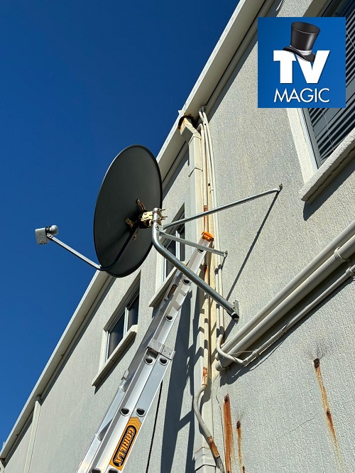 A satellite dish relocation job. Logo in top right corner