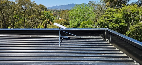 Starlink dish installed on a tin roof