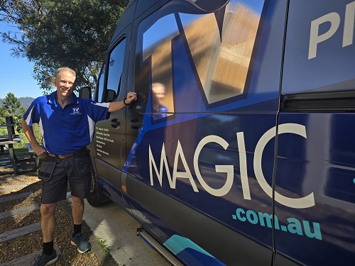 Technician - Robert, standing next to his van.