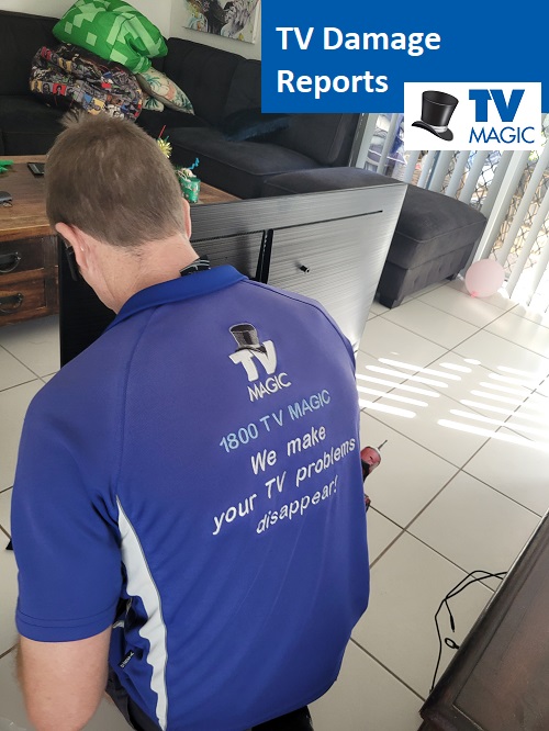 Technician assessing a broken TV