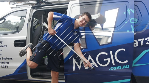 Technician holding a TV Magic antenna