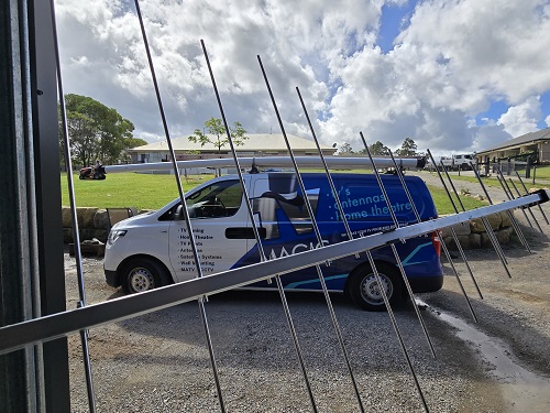 TV Magic van parked in customer driveway - Antenna held in front