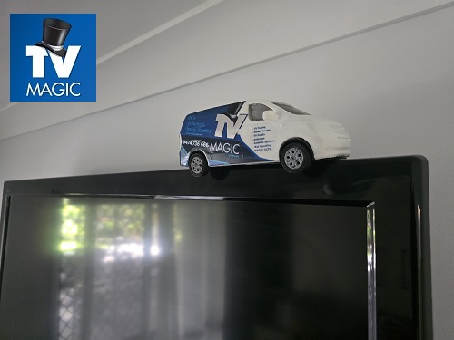 wall mounted TV with mini TV Magic van on top