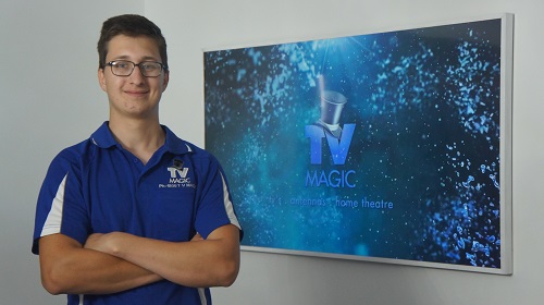 Technician - Keith in front of a TV ready to transport