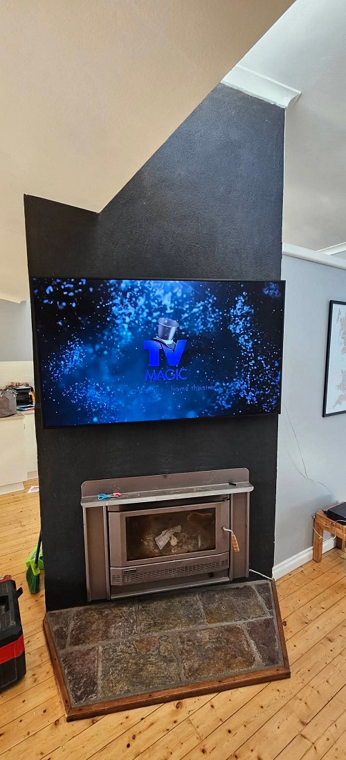 A wall mounted TV setup by TV Magic.