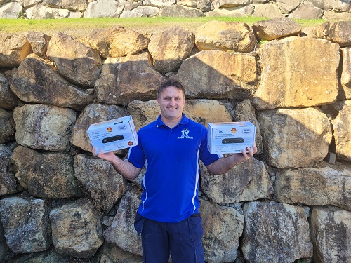 Technician holding x2 vast boxes