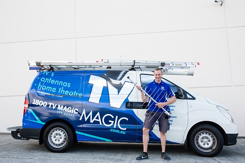 Paul next to his van with an antenna.
