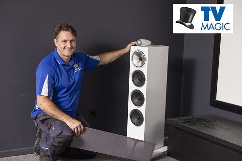 Technician with a home cinema he designed