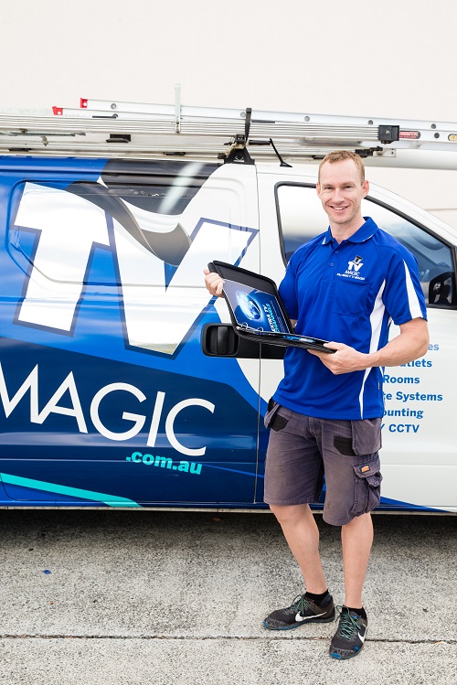 Technician - Paul, next to his van, holding a folder
