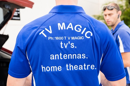 Technician with back of shirt showing.