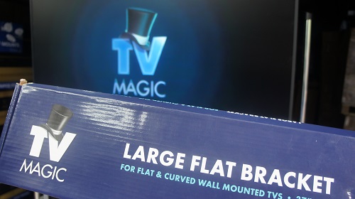 A Vertical TV installation with a large TV Magic wall bracket in front of it.