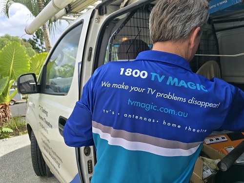 Technician - Jason, with back of his shirt showing.