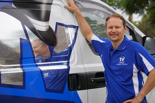 technician - Jason leaning on his van