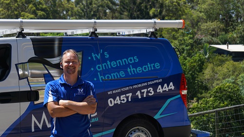 Technician - Jason, standing in front of his van
