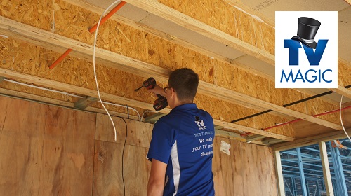 Technician working on a pre-wire fit out