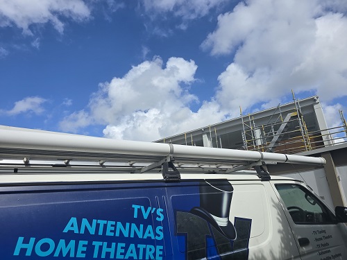TV Magic van in front of a new build.