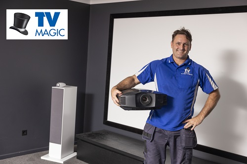 Technician holding projector - Logo top left