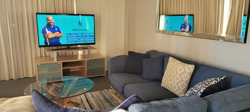 Living room with TV. Satellite dish installation at this property performed by Jake - TV magic
