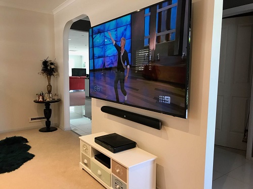 A complete TV setup with floating soundbar, installed by TV Magic!
