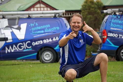 Technician kneeling down - making the motion to give him a call.