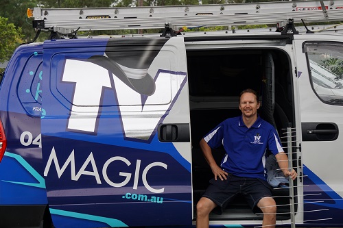 a photo of technician - Jason with an antenna, sitting in his van