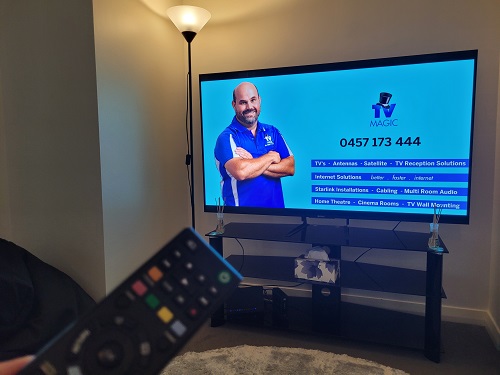 TV with a remote. Reception repaired by Jake - TV Magic!