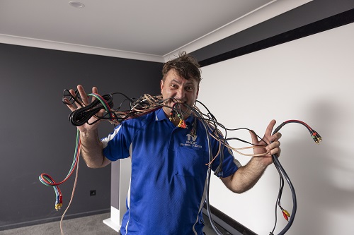 Technician with tangled cables