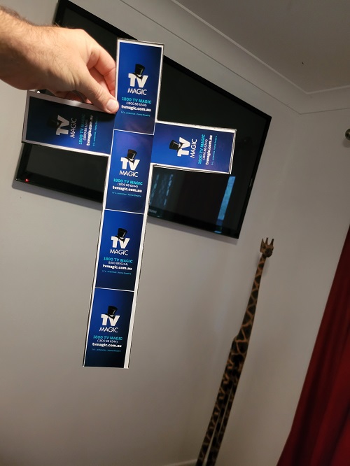 TV Magic cross in front of a TV