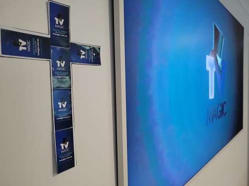 Frame TV with Logo on screen. Cross on the left