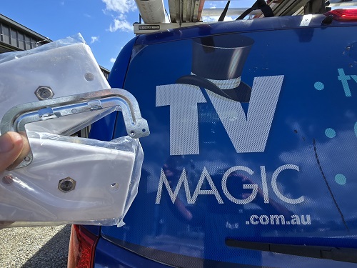 Foxtel point held up in front of van