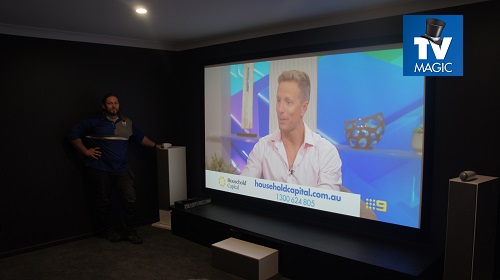 a projector screen with an image on it, in a home cinema