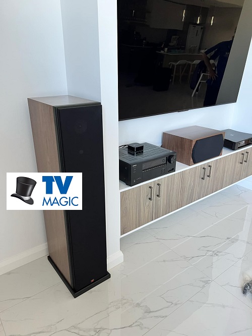 A complete home theatre setup by TV Magic. Logo middle left