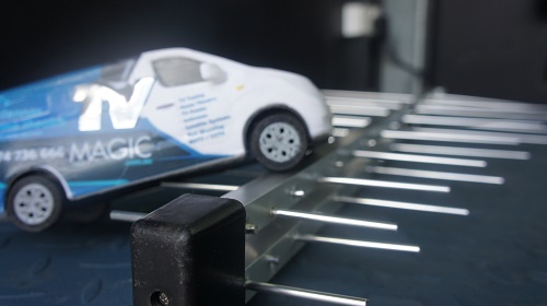 close up of an antenna with a mini TV Magic van on top