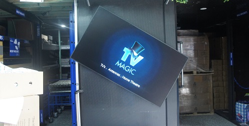a rotating TV with TV Magic logo and services on screen