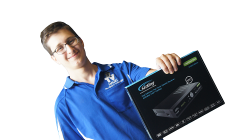 Technician holding a vast TV set-top-box