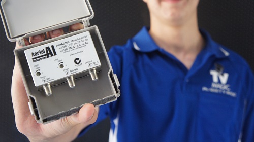 Technician holding an amplifier