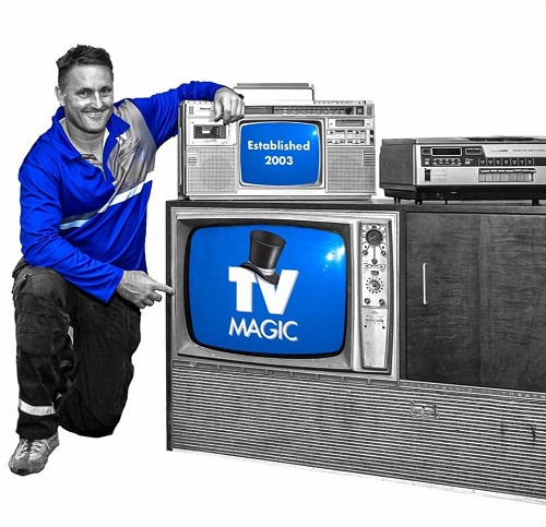 Technician with old TVs